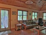 The spacious living area has large windows with gorgeous views, gas log stove, flat screen tv